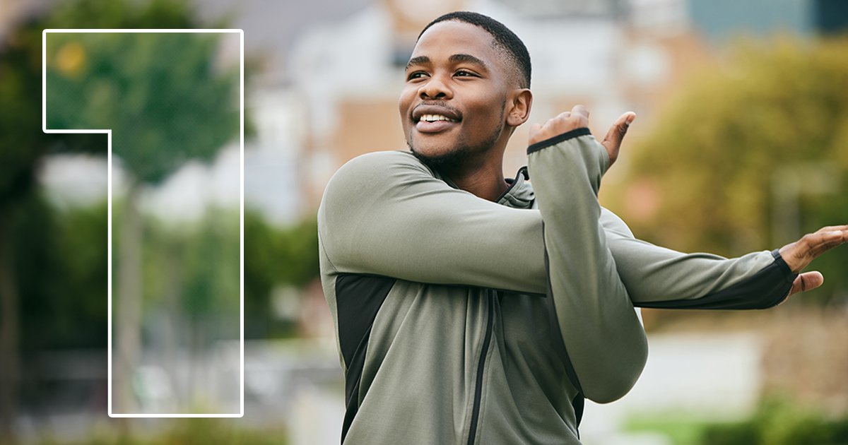young man stretching outside