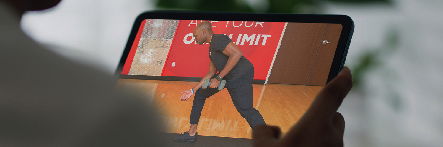 Person viewing workouts on tablet