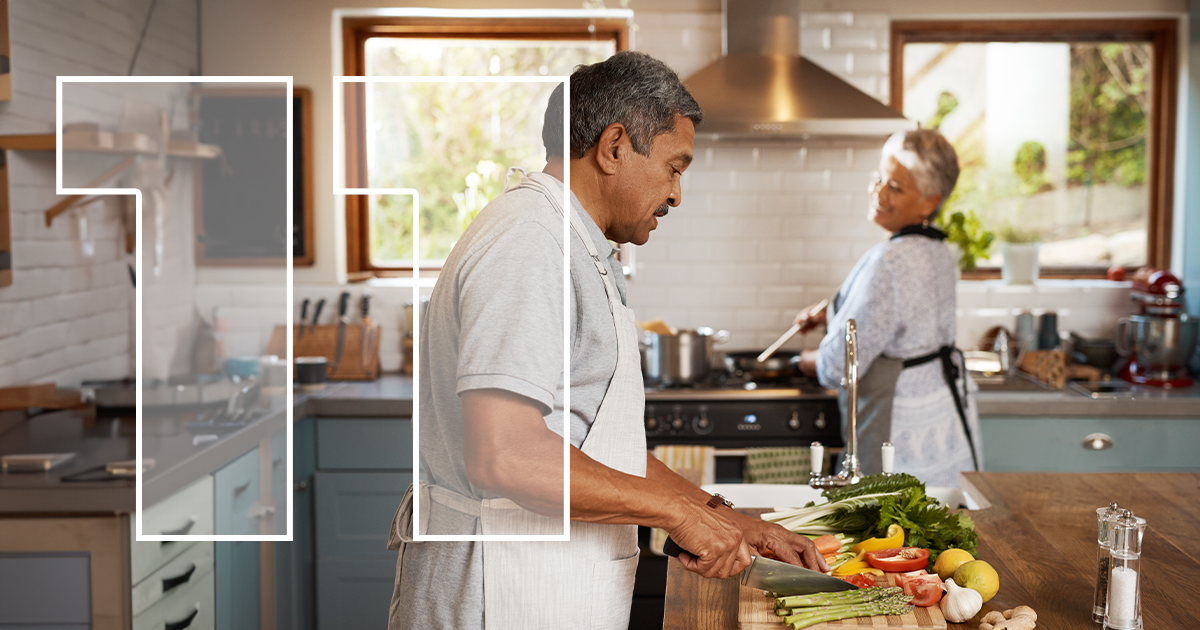two people cutting vegetables