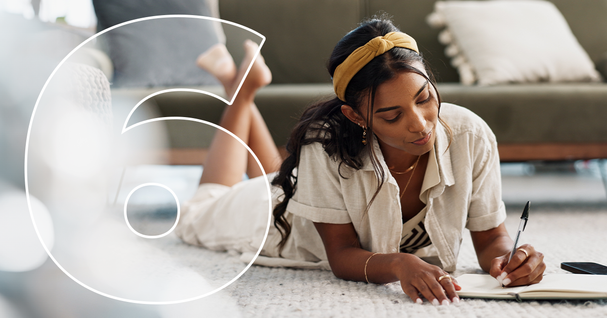 Woman, writing and home with notes in living room for planning a schedule and checklist